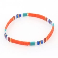 Close-up of bohemian Tila bead bracelet with turquoise, orange tiles and golden accents - Orange/Turquoise/Dark Blue/White/Gold (TL-B190243G)