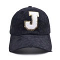 Detail of black baseball cap featuring leopard print fabric and fuzzy letter J patch - Letter J Style (J-漏洞马尾棒球帽)