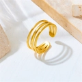 Macro detail of triple-layer gold plated stainless steel open ring on stone pedestal - Gold Three-layer Open Ring