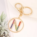 Detail of gold letter N keychain featuring vibrant multi-colored rhinestones and lobster clasp - Letter N