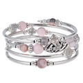 Detailed close-up of Bohemian multi-layer bracelet with natural stone beads and charms - Pink Zebra Jasper Style