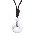Macro detail of white turquoise donut pendant with black handmade braided cord necklace - White Turquoise Necklace