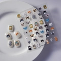 Close-up of cute 3D embossed cat nail stickers with various kitty patterns and white tips - Cartoon Cat Illustration Series (FEB-512)