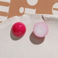Macro view of dome-shaped resin heart beads in vibrant pink and soft pastel tones - Rose Red Round