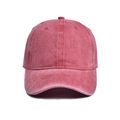 Detailed macro view of vintage washed fabric texture on a solid color baseball cap - Red