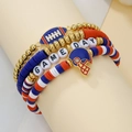 Detail view of four-piece handmade sports bracelet set with rugby charms and letter beads - SY0718-1 Gold Blue Red White 4pcs Set