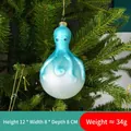 Icy blue octopus glass Christmas ornament with glitter finish on pine branch - Model 04-Ice Blue Gradient Octopus