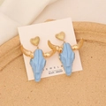 Close-up of Bohemian bull head earrings with light blue enamel and S925 silver needle - Lake Blue