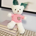 White teddy bear in pink knit sweater sitting on books for a cozy home atmosphere - White Bear - Pink Sweater Badge / 30cm