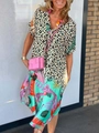 Close-up of V-neckline detail on a colorful leopard and tropical print summer dress - S / Tops / Leopard Print