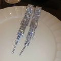 Elegant silver tassel earrings with sparkling rhinestones displayed on white porcelain - 14# Gun Black Tassel with Silver Pin