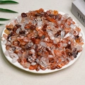 Natural orange and brown tumbled crystal quartz stones for home decor in a white tray - 100g Of Red Styrax Flowers (7-9mm)