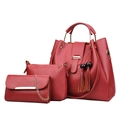 Three-piece red PU leather handbag set with tassels and gold hardware on white background - Burgundy