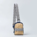 Beige woven crossbody chest bag with blue leather trim and geometric diamond pattern strap - Blue