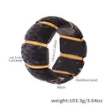 Detail view of 4.1cm wide elastic resin bracelet with gold stainless steel texture - 60mm / Black (E679)