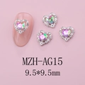Detail of 9.5mm aurora heart nail gems with silver metal frame on a pink background - Silver Base Pink Green Style(AG15)