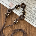 Detailed shot of ethnic necklace with dark wooden rings and beaded woven cords - Dark Brown Wood Ring Seed Bead Style