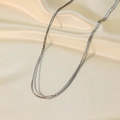 Three-layer silver stainless steel layered necklace on elegant silk background - Four Layer Chain Style (H6189) / Necklace / Steel