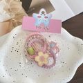 Pink elastic flower hair ties set featuring spiral and fabric scrunchies on a ceramic plate - 4-Flower Pink (4 Pcs)