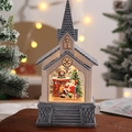 Dettaglio della sfera di neve luminosa casa di Babbo Natale con glitter e decori - Babbo Natale