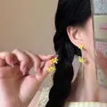 Close-up of floral tassel earrings with yellow petals and green crystal droplet detail - Yellow 3D Flower Long Style (18# Silver Earring Post)