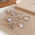 Detail of silver alloy ring set featuring minimalist pearls and irregular lava textures - Silver (7-Piece Set)