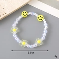 Beaded moonstone bracelet with yellow smiley face and floral charms on grey background - Smile + Little Flower Style (K3339)