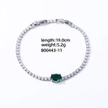 Silver-colored tennis bracelet featuring clear zircons and an emerald green oval stone - Silver Oval Green Zircon