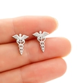 Macro detail of silver medical caduceus earrings made of polished stainless steel - Steel