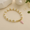 Fashionable pearl and gold bead bracelet with pink shell pendant on neutral background - Pink Shell Pendant