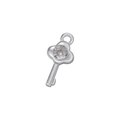 Macro shot of silver key pendant with micro-pave zircon stone inlay for DIY jewelry - White Gold Key