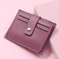 Close-up of purple litchi grain faux leather card holder with 4 slots and snap button - Deep Pink