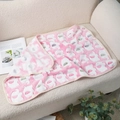 Pink coral fleece pet blanket with elephant pattern and size L tag on sofa - Pink Elephant