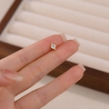 Minimalist S925 silver star stud earring in gold finish with a light blue gemstone - Octagram Gold Single Piece