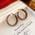 Chic twisted hoop earrings in deep burgundy red finish with a glossy enamel texture - Coffee (Style 7 Retro Hoop)