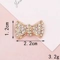 Gold bow-shaped charm accessory with sparkling rhinestones, 2.2cm x 1.2cm size detail - D852 Small Rhinestone Bowknot