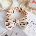 Plush leopard print headband with oversized bow for skincare and makeup routines - Light Beige Leopard