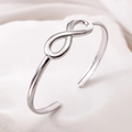Elegant silver stainless steel bracelet featuring a minimalist infinity symbol design - Infinity / Steel