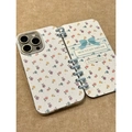 Floral notebook style iPhone case with bow and blue binder rings on felt background - Full Floral + Blue Ring / iPhone 16 Pro Max