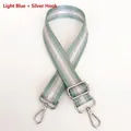 Close-up of adjustable nylon bag strap in light blue with silver sequin stripes - Light Green + Silver Hook