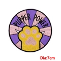Detailed embroidery of Pupper Power patch with golden paw print and purple background - Pupper Power Paw