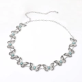 Detailed macro view of butterfly metal waist chain with turquoise-tone stone inlays - 10 Turquoise Butterflies / Silver