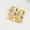Details von goldenen Croissant-Ohrringen mit Unendlichkeitsdesign und weißen Zirkonia - Weißer Zirkonia Gedreht