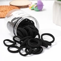 Jar of 50 black high-elastic seamless hair ties in a clear plastic container - Pure Black (50Pcs Jar)