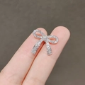 Silver bowknot brooch with clear crystals shown on hand for size perspective - 73# Gold Bowknot