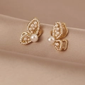 Baroque pearl butterfly stud earrings with sparkling zircons on champagne silk background - Butterfly Wing Pearl Stud Earrings