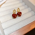 Detailed macro shot of gold-plated heart earrings with rich red drip glaze finish - Real Gold Plated Enamel Heart Hoop Earrings