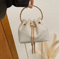 Cream rhinestone drawstring bucket bag with sparkling silver gems and gold chain strap - White