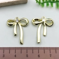 Golden bow charms for jewelry making, one with rhinestones, size 2cm reference - Rhinestone Bowknot - KC Gold (21394)