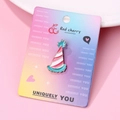 Detail of pink and white enamel party hat brooch pin displayed on branded paper card - Party Hat Shape (091)